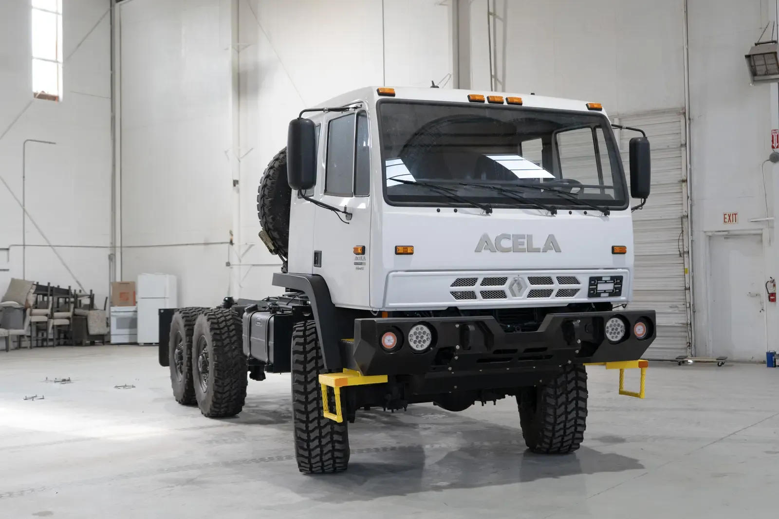 White Acela Monterra 6x6 cab-chassis, body-ready, front three-quarter view in the Foundation Vehicles shop