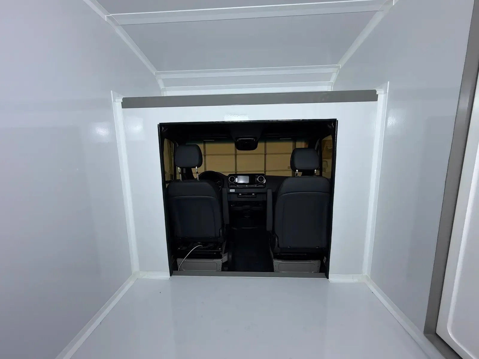 Inside the composite body, cab pass-through framing the front seats